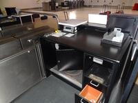 A pair of check in desks with Avery Weigh-Tronix scales