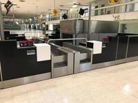 A pair of check in desks with Avery Weigh-Tronix scales