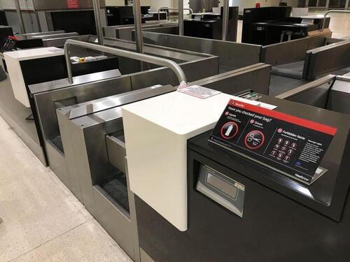 A pair of check in desks with Avery Weigh-Tronix scales