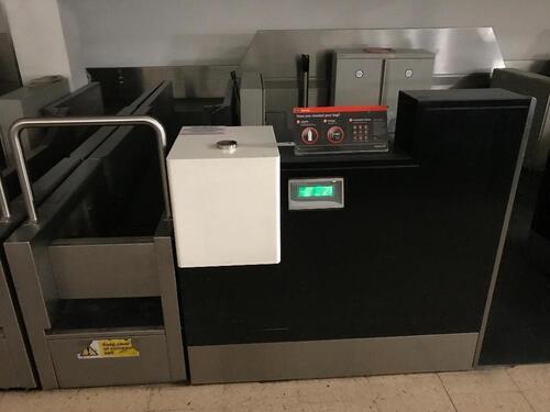 A pair of check in desks with Avery Weigh-Tronix scales