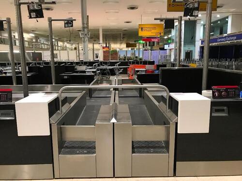 A pair of check in desks with Avery Weigh-Tronix scales