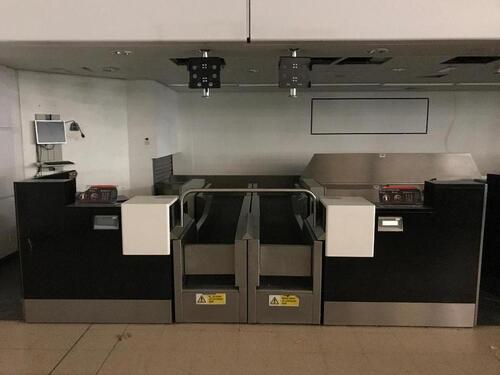 A pair of check in desks with Avery Weigh-Tronix scales