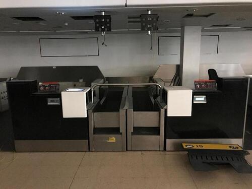 A pair of check in desks with Avery Weigh-Tronix scales