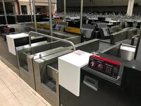 A pair of check in desks with Avery Weigh-Tronix scales