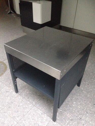 Stainless steel topped "security search table", grey perforated steel sides and legs, incorporating a single under shelf. Adjustable height on legs. W 750mm H 850mm D 770mm<br />