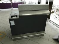 Left side security information desk. Stainless steel frontage and kick bar. Lockable cupboard and storage shelf. Width 1200mm, depth 900mm, height 1200mm.