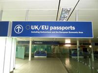 Illuminated 'EU/UK passports' sign, metal construction