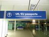 Illuminated 'EU/UK passports' sign, metal construction