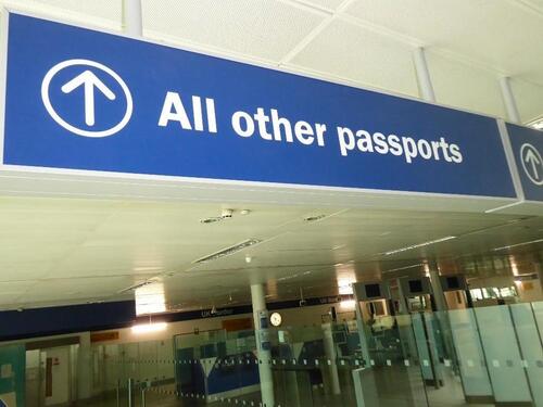 Illuminated 'All other passports' sign, metal construction