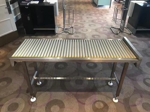 Baggage scanning stainless steel conveyor bench with 44 rollers.Length: 1500mm  Width: 550mm  Height: 860mm