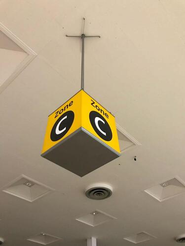 Zone C' ceiling mounted illuminated location sign