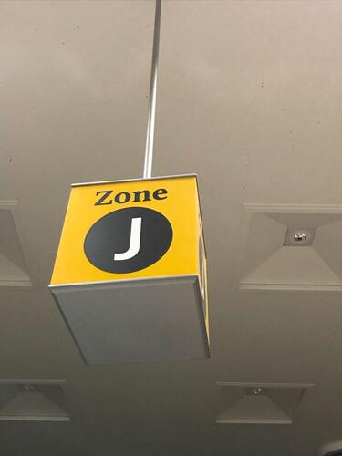 Zone J' ceiling mounted illuminated location sign