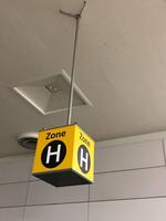 Zone H' ceiling mounted illuminated location sign