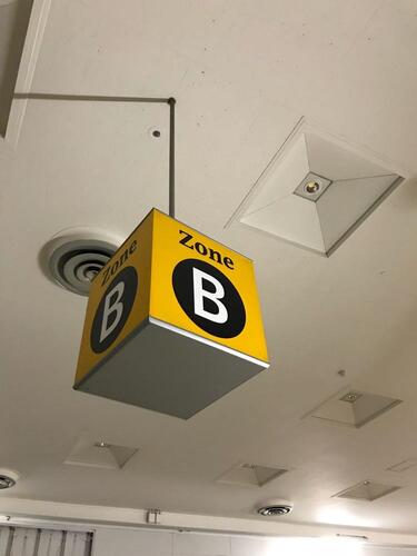 Zone B' ceiling mounted illuminated location sign