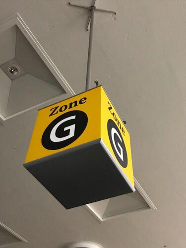 Zone G' ceiling mounted illuminated location sign
