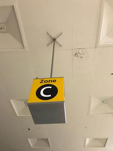 Zone C' ceiling mounted illuminated location sign