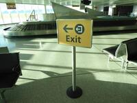 Heathrow stand mounted 'Exit? sign.