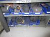 (LOT) SHELVING WITH CONTENTS, PVC FITTINGS, BELTS, CABLES, PLUMBING PARTS, TARPS, HELMETS, VESTS, DISPOSABLE GLOVES, EAR PLUGS, AND COVERALS (MAINTNAN - 5