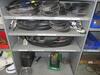 (LOT) SHELVING WITH CONTENTS, PVC FITTINGS, BELTS, CABLES, PLUMBING PARTS, TARPS, HELMETS, VESTS, DISPOSABLE GLOVES, EAR PLUGS, AND COVERALS (MAINTNAN - 21