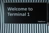 Wall mounted 'Welcome to Terminal 1' sign, metal box construction with curved profile back. - 3