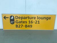 Departure lounge 'Gates 16-21 B7-B49' Yellow Sign With Metal Frame