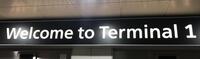 Wall mounted 'Welcome to Terminal 1' sign, illuminated framed sign