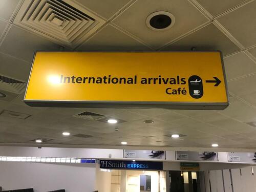 International arrivals and Cafe illuminated sign