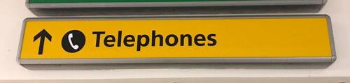 ‘Telephones’ illuminated wall sign