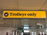 Trolleys only illuminated metal box sign