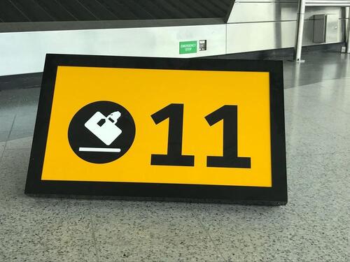 Baggage collection ‘11’ illuminated sign