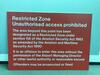 Restricted Zone sign on fibreboard - 2