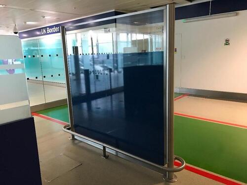 Two panel glass partition with metal base