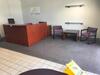 Reception Area Furniture to Include: 71" x 76" Reception Cube with chair, 108" Desk Return, two (2) Waiting Chairs, Table, Small Conference Table, four (4) Chairs and Enclosed White Board. Sale is subject to seller confirmation. Location: Administrative A