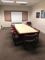 120" Conference Table with eleven (11) Matching Chairs and Projection Screen/Whiteboard Cabinet. Sale is subject to seller confirmation. Location: Administrative Area