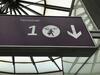 Illuminated 'Terminal 1' purple sign and hidden bonus sign - 5