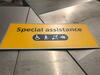 Wall mounted metal sign, showing 'Special assistance' message. - 3