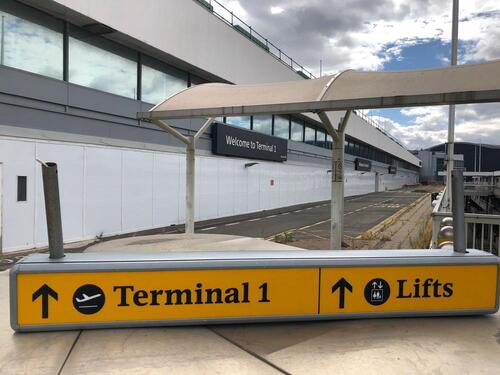 Illuminated sign, showing Terminal 1 & lifts