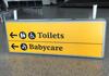 Illuminated 'Toilets & Babycare' Direction Sign