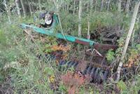 LOT OF MISCELEANEOUS ITEMS WEST OF THE TREELINE NORTH OF THE FIELD ENTRY ROAD PUMPS, PANELS, FENCE POSTS, MAN BASKETS, WEEPING TILE, OLDER FARM EQUIPM