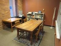 LOT 6'FT WOOD TABLE WITH (4) WOOD CHAIRS, BOOKCASES WITH BOOKS, RUG, BLACK 2-DRAWER FILE CABINET, TABLE, AND (4) ASST'D CHAIRS, (LOCATION: SHOEN LIBRARY GROUND FLOOR)