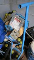 LOT, CONTENTS OF CLOSET, BALLS, SOFTBALL PITCHING MACHINE, PADS, SALT RIVER COMPLEX, FLOOR, RM LOWER DIAMOND