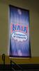 LOT, 13 MID SOUTH CONFERENCE SCHOOL BANNERS, CURRENTLY ON GYM WINDOWS AND WALL, LOURDES, UPPER FLOOR, RM GYM - 12