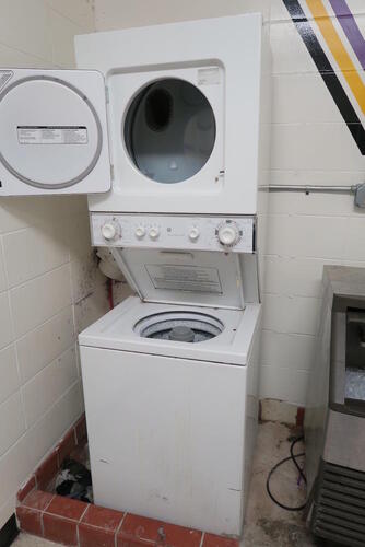 GE STACKABLE ELECTRIC WASHER/DRYER COMBO. , LOURDES HALL, LL FLOOR, RM GIRLS LOCKER ROOM