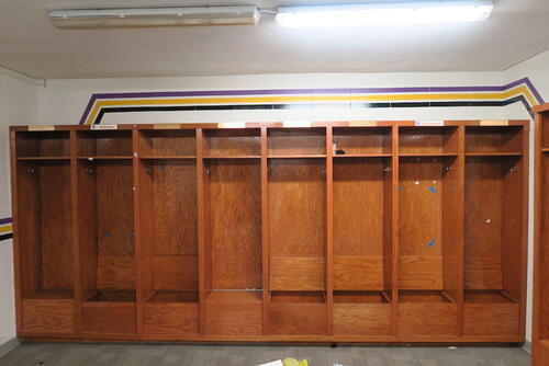 15-WOODEN DRESSING LOCKERS, (3 CABINETS TOTAL), GROUP OF VOLLYBALL UNIFORMS, GROUP OF CHEERLEADER UNIFORMS, LOURDES HALL, LL FLOOR, RM GIRLS LOCKER ROOM