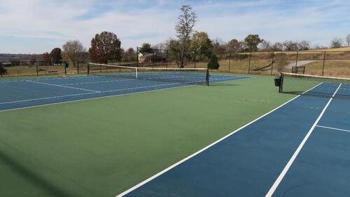 LOT, 3 TENNIS NETS AND POLES, ALL BALLBINS AND RAQUET HOLDERS, ROLLER MOPS, BROOMS, 1 PICNIC TABLE, LOWER TENNIS COURT, FLOOR, RM