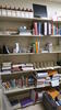 LOT, CONTENTS OF ROOM, BOOK SHELVES, MISC BOOKS, 2 DOOR STORAGE CABINET, MISC OFFICE SUPPLIES, MISC VIDEO MACHINES, SLIDE PROJECTOR, A/V CABLES, AS SHOWN, HUNDLEY, 1ST FLOOR, RM 107 - 2