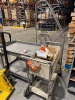 (LOT) ASSORTED SPARE PARTS, BELTS, ELECTRICAL WIRE, WHEELS, BREAKERS, SENSORS, MOTORS, LADDER, RACKS, WORK BENCH, CABINET AND DESK - 8