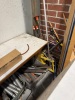 (LOT) ASSORTED SPARE PARTS, BELTS, ELECTRICAL WIRE, WHEELS, BREAKERS, SENSORS, MOTORS, LADDER, RACKS, WORK BENCH, CABINET AND DESK - 9