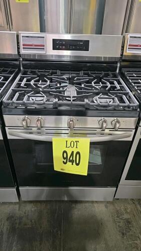 Frigidaire FCRG3062ASB 30" Black Freestanding Gas Range featuring 5 burners, including an 18,000 BTU Quick Boil burner, 5.1 cu. ft. oven capacity, steam clean function, and manual knobs with digital controls. Serial Number: VF40684988.