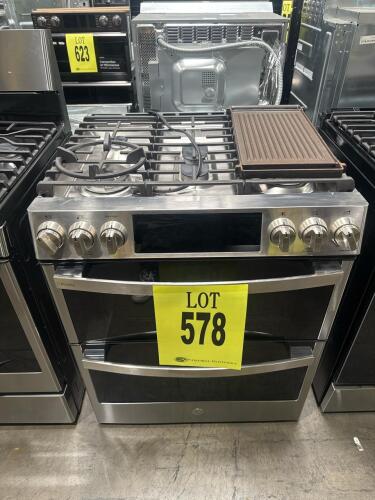 GE Profile PGS960YP2FS Double Oven Gas Range featuring 5 burners, True Convection, and a stainless steel finish, includes griddle plate and burner grates, Serial Number: AT172858P, RETAIL: $3799